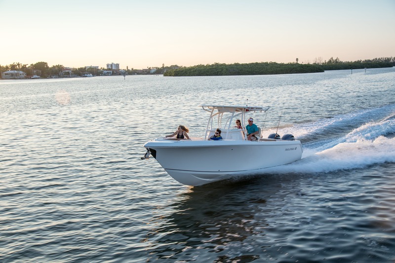 sailfish boat driving through the ocean in destin, florida