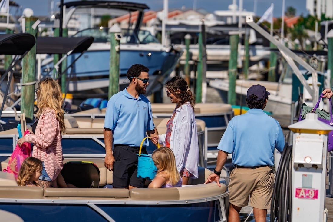 legacy crew helping family load the boat in destin fl