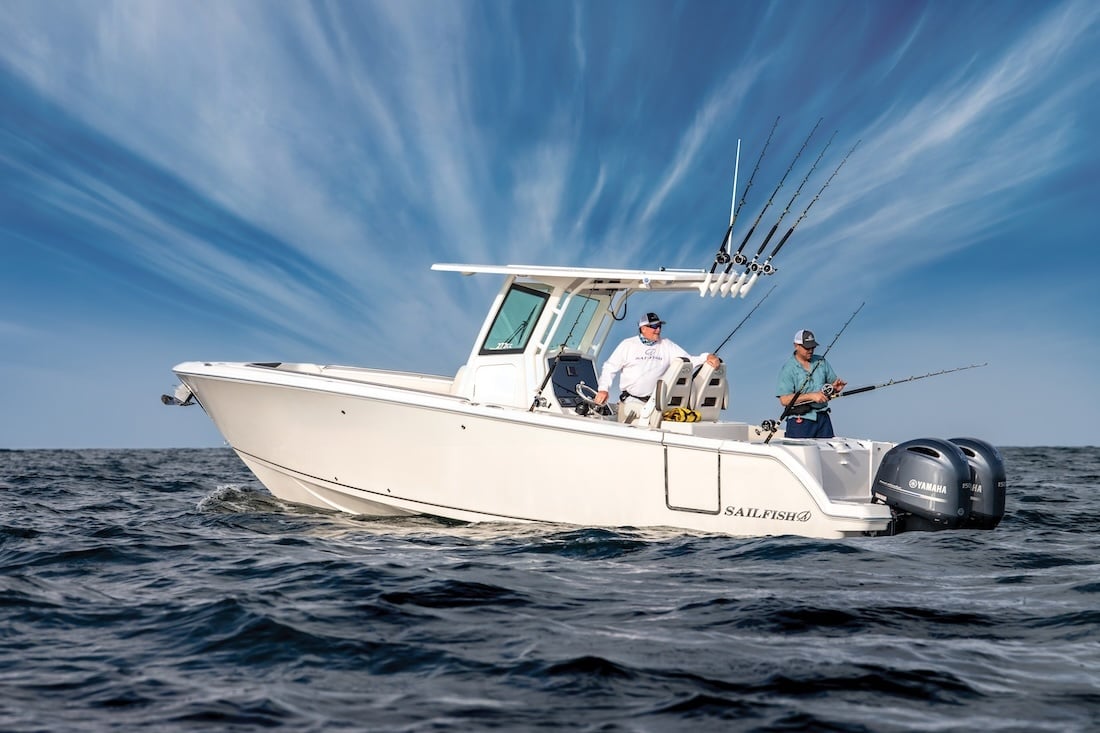 men fishing aboard a sailfish 272 twin engine center console boat in deep sea