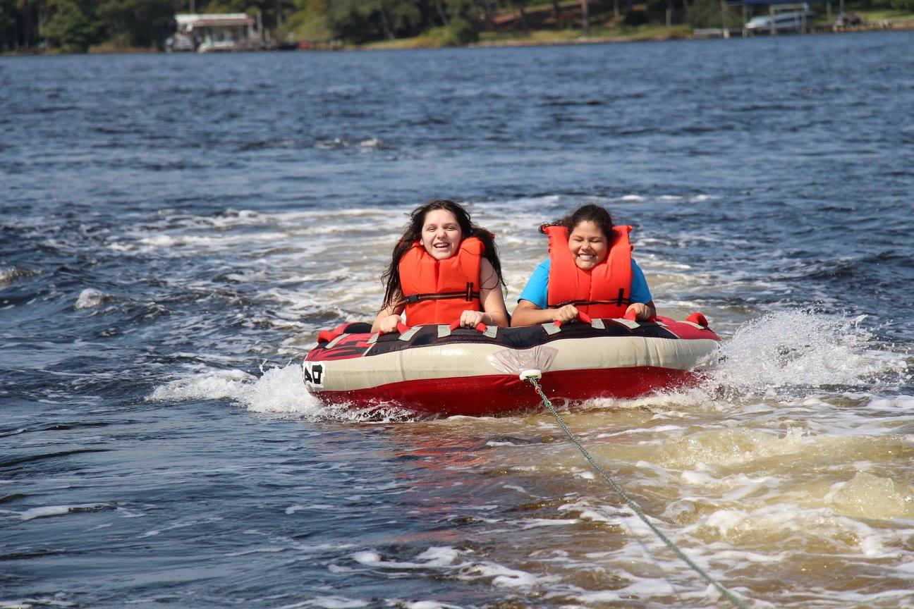 two girls tubing on the water in Destin, Florida