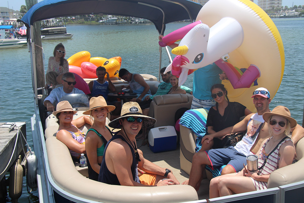 Family on a Tritoon boat in Destin, Florida