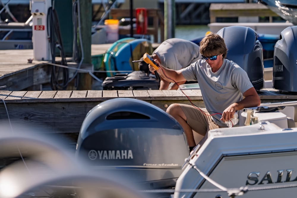 legacy maintenance team prepping sailfish single engine boat